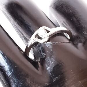 Slender Ring Silver Tone Metal Cradling Single Clear Stone
